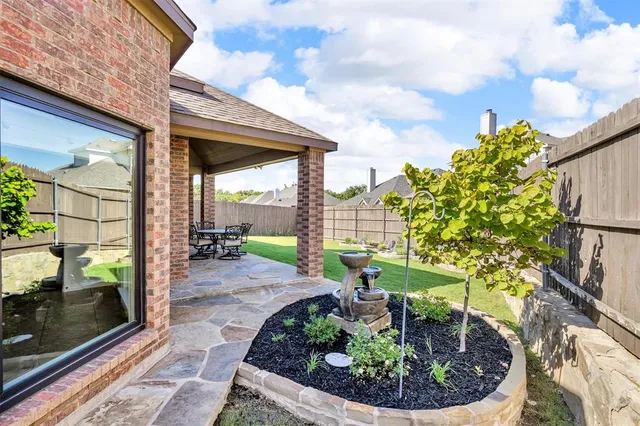 a view of a backyard with garden