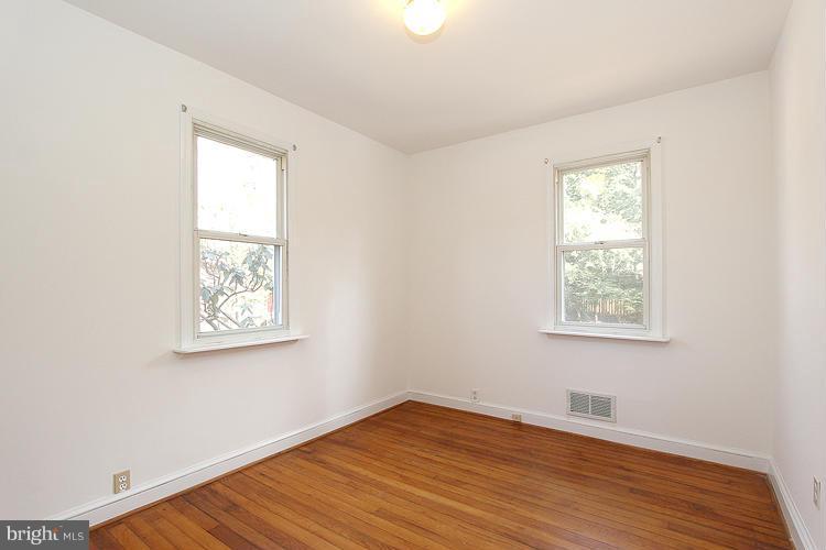 11601 Gail Place Silver Spring, MD 20902 - Photo 20 of 30 a view of an empty room with wooden floor and a window