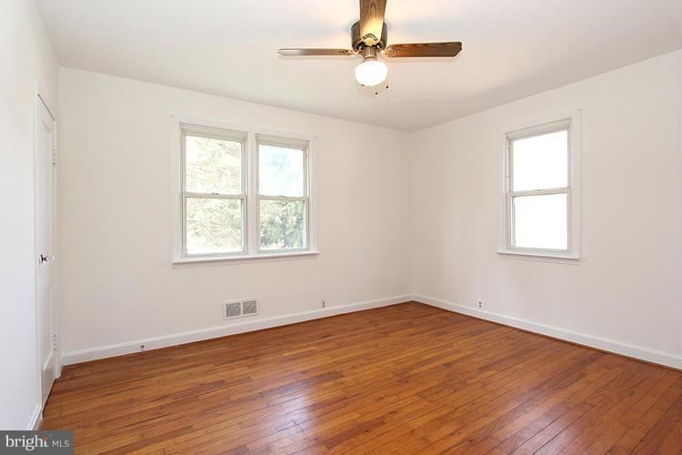 11601 Gail Place Silver Spring, MD 20902 - Photo 21 of 30 wooden floor in an empty room with a window