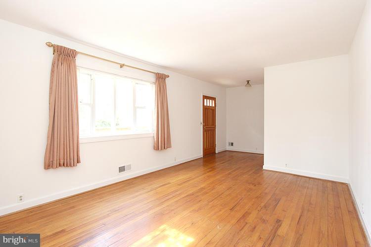 11601 Gail Place Silver Spring, MD 20902 - Photo 8 of 30 a view of an empty room with wooden floor and a window