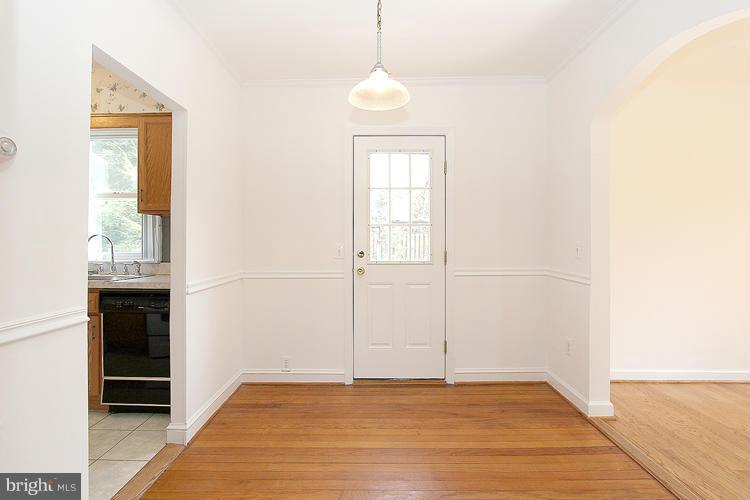 11601 Gail Place Silver Spring, MD 20902 - Photo 10 of 30 a view of an empty room with window and wooden floor