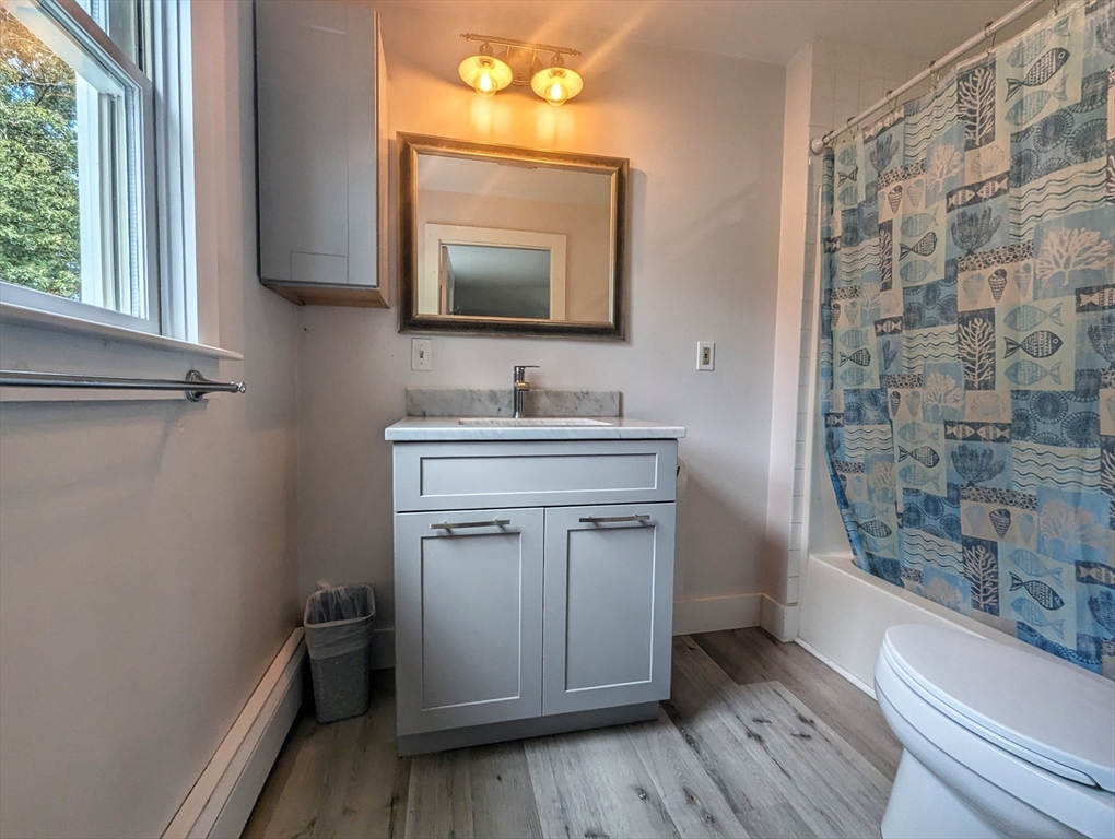 106 Great Neck Road Wareham, MA 02571 - Photo 19 of 30 a bathroom with a sink a toilet and a mirror