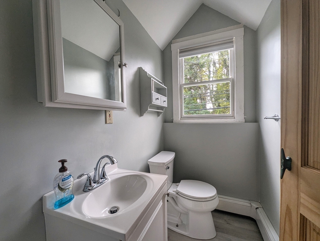 106 Great Neck Road Wareham, MA 02571 - Photo 23 of 30 a bathroom with a toilet sink and mirror