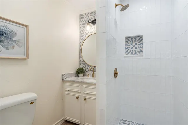 a backyard of a house with barbeque oven and potted plants