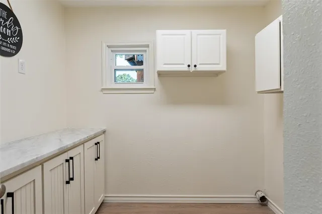 a bedroom with furniture and wooden floor