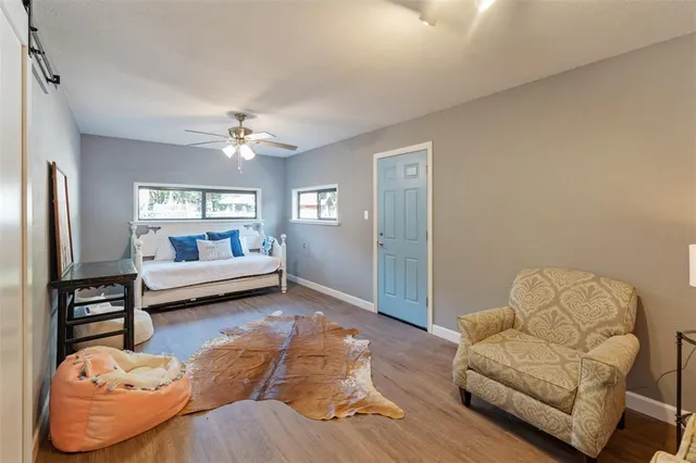 a living room with furniture and windows