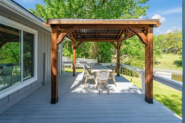 a view of swimming pool with outdoor seating and yard