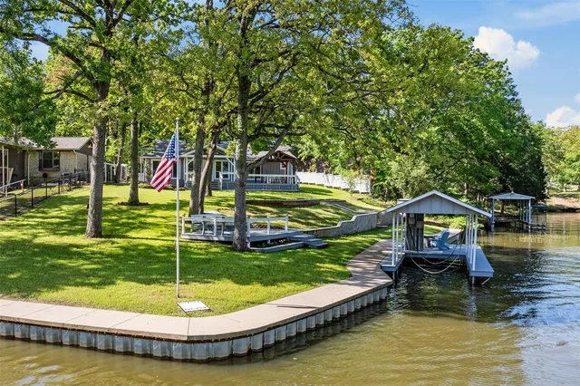 an aerial view of a house with a yard and garden