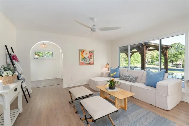 a living room with furniture and a large window