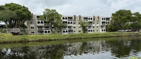 a view of building with outdoor space and garden