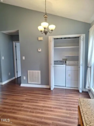 a garden with trees in front of it