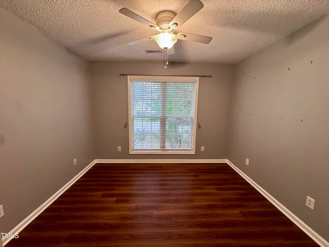 a view of a backyard with sitting area