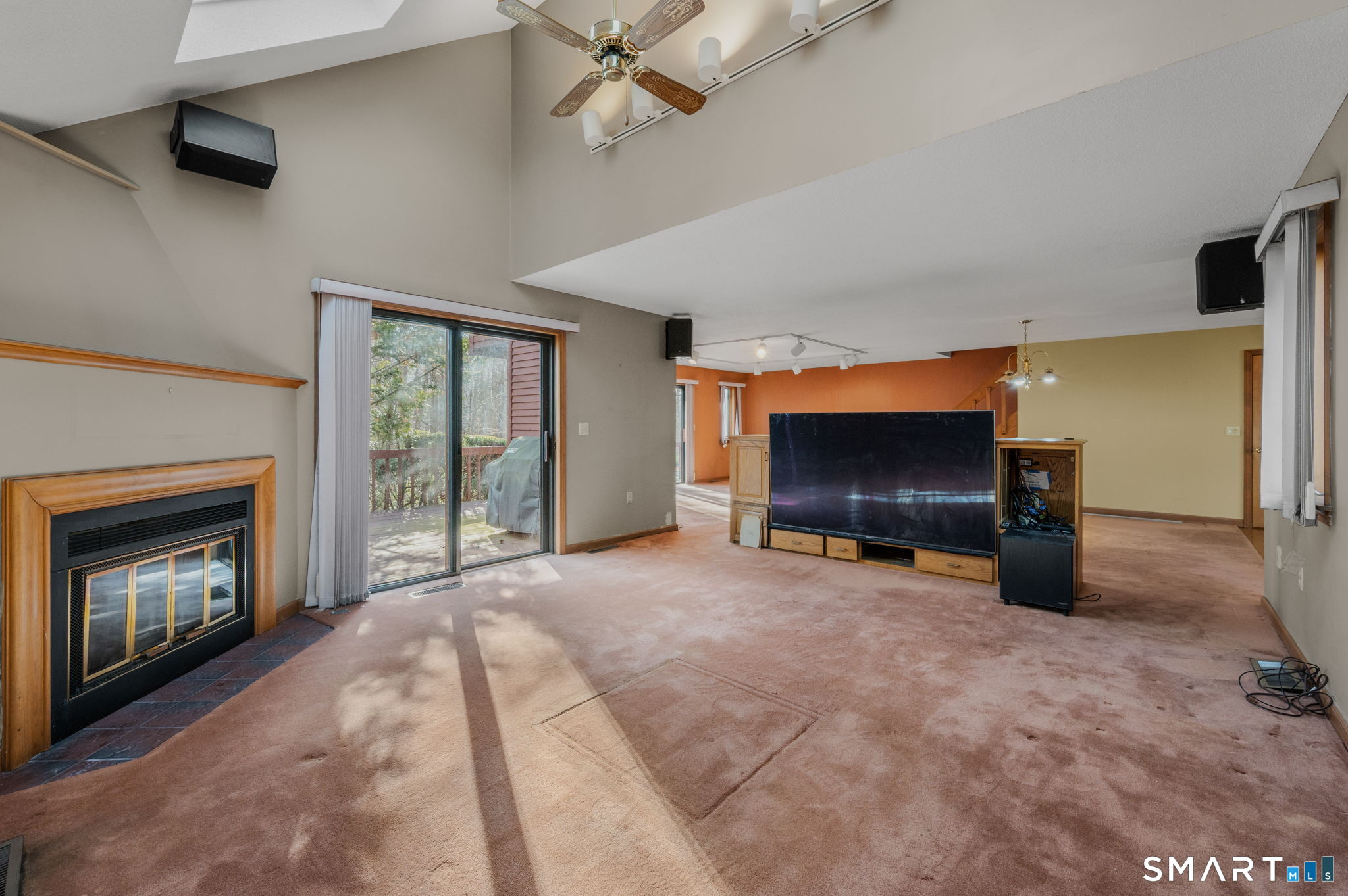 97 West Main Street, Unit 24 East Lyme, CT 06357 - Photo 13 of 39 a living room with furniture and a fireplace