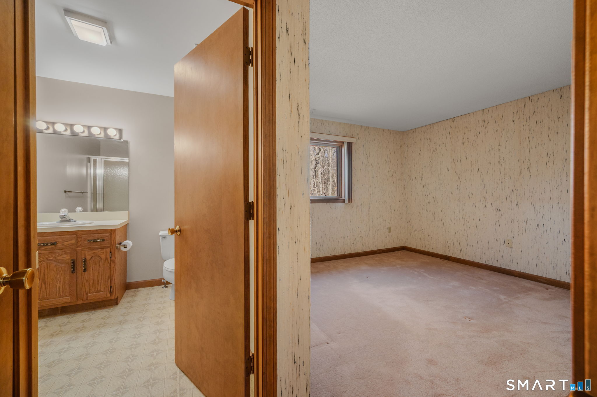 97 West Main Street, Unit 24 East Lyme, CT 06357 - Photo 16 of 39 a view of a bathroom with a sink and a mirror