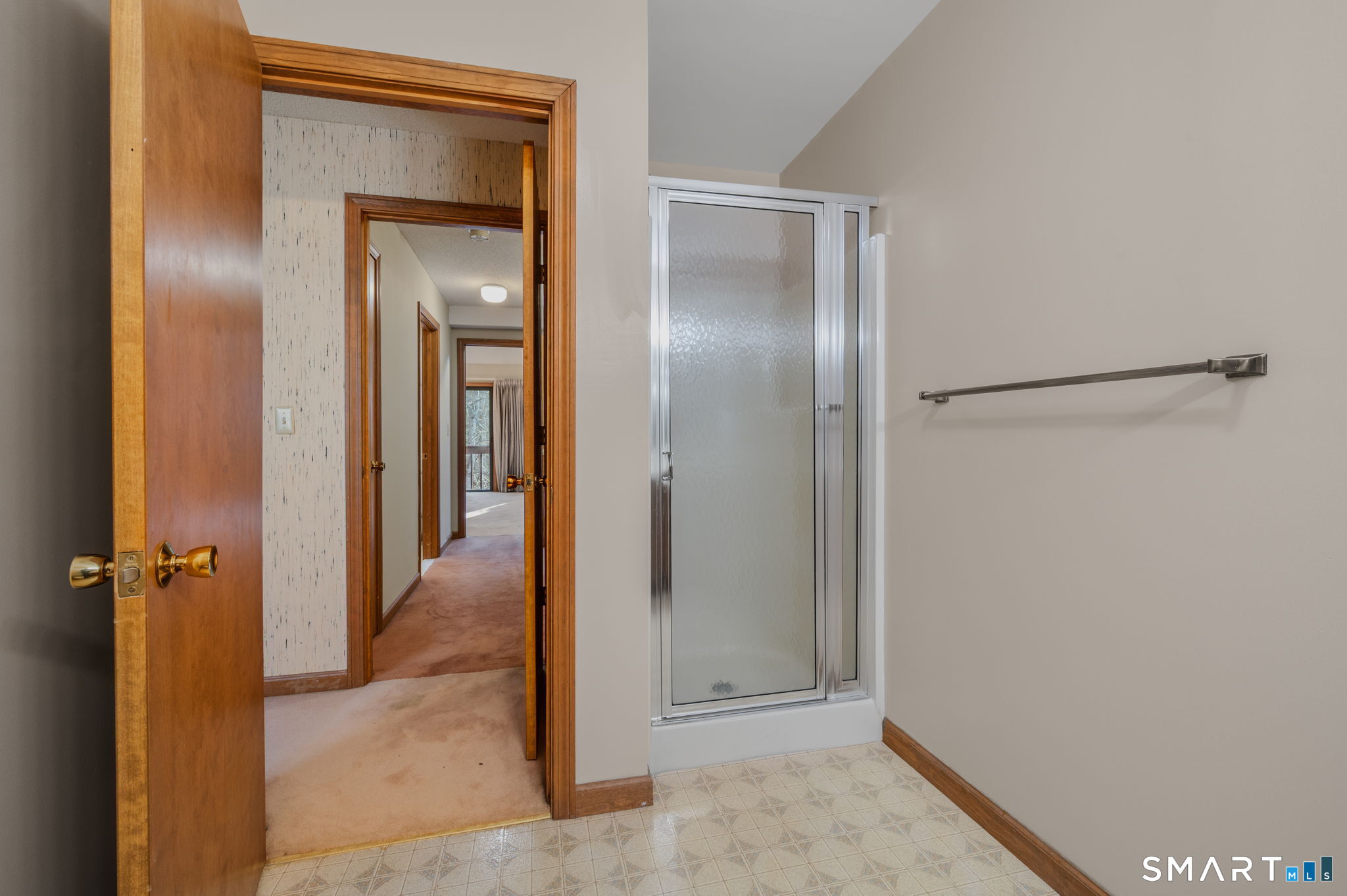 97 West Main Street, Unit 24 East Lyme, CT 06357 - Photo 17 of 39 a view of a bathroom with a glass door
