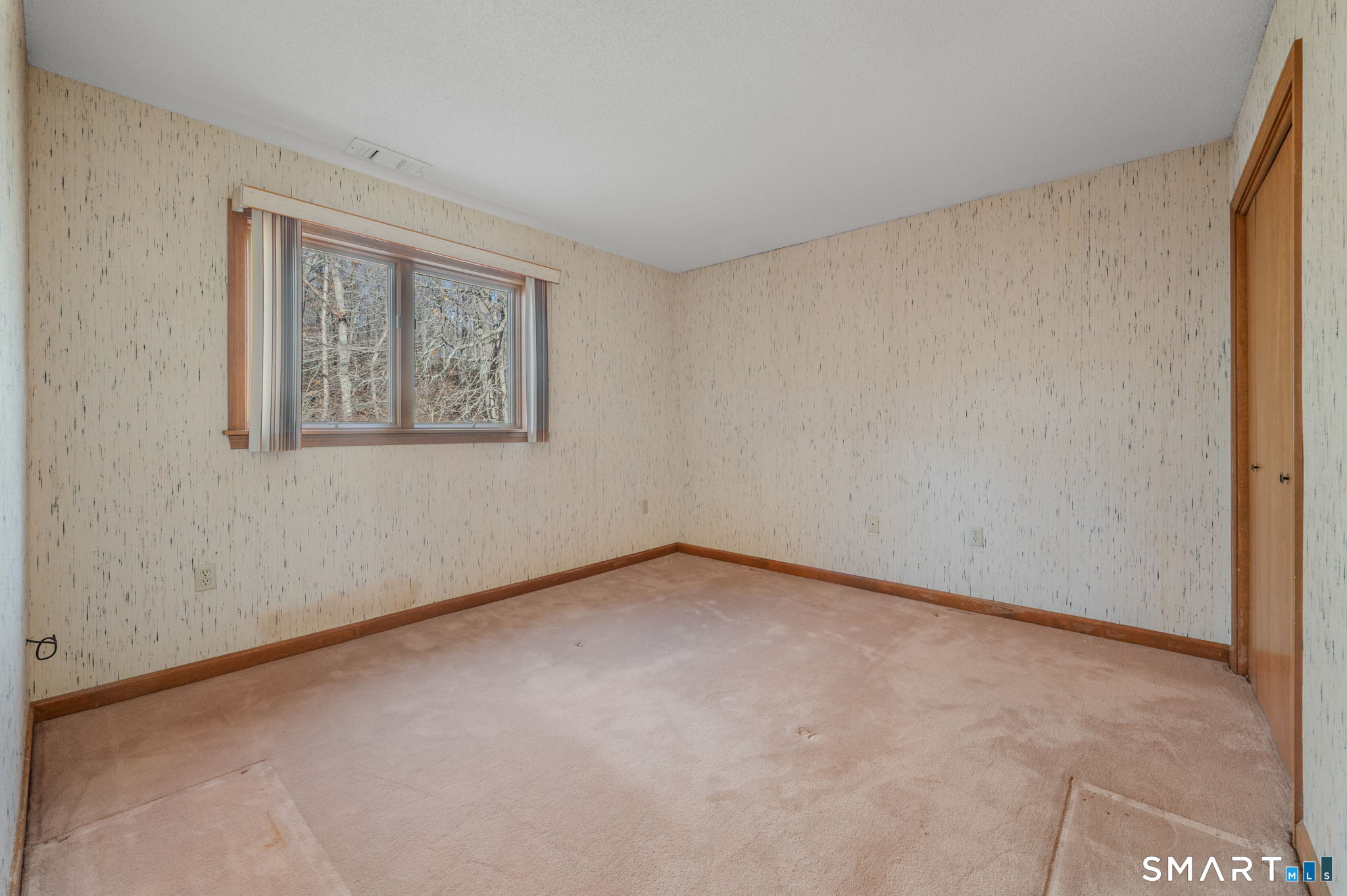 97 West Main Street, Unit 24 East Lyme, CT 06357 - Photo 18 of 39 a view of an empty room with a window