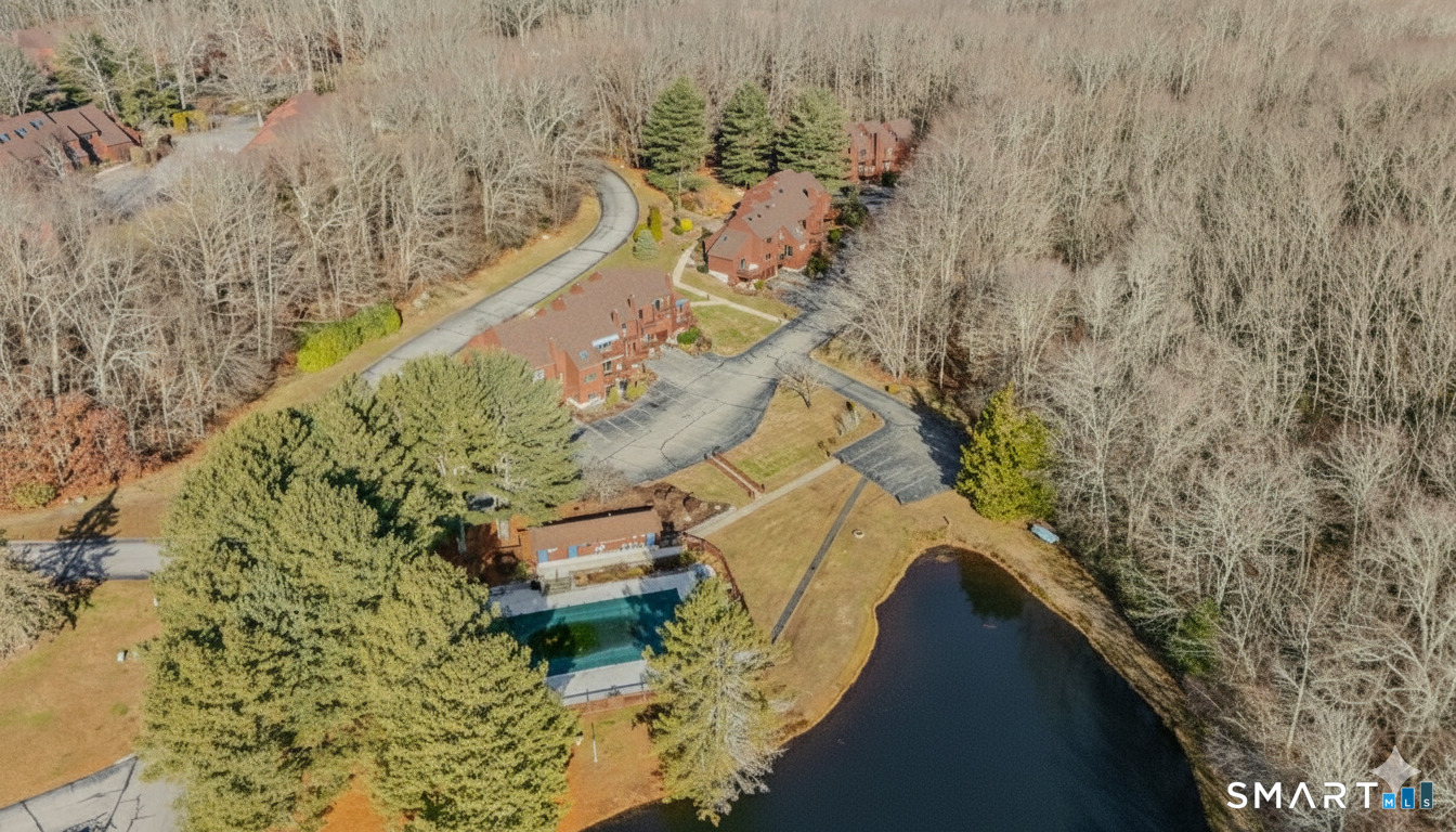 97 West Main Street, Unit 24 East Lyme, CT 06357 - Photo 3 of 39 a bird view of a house with a yard