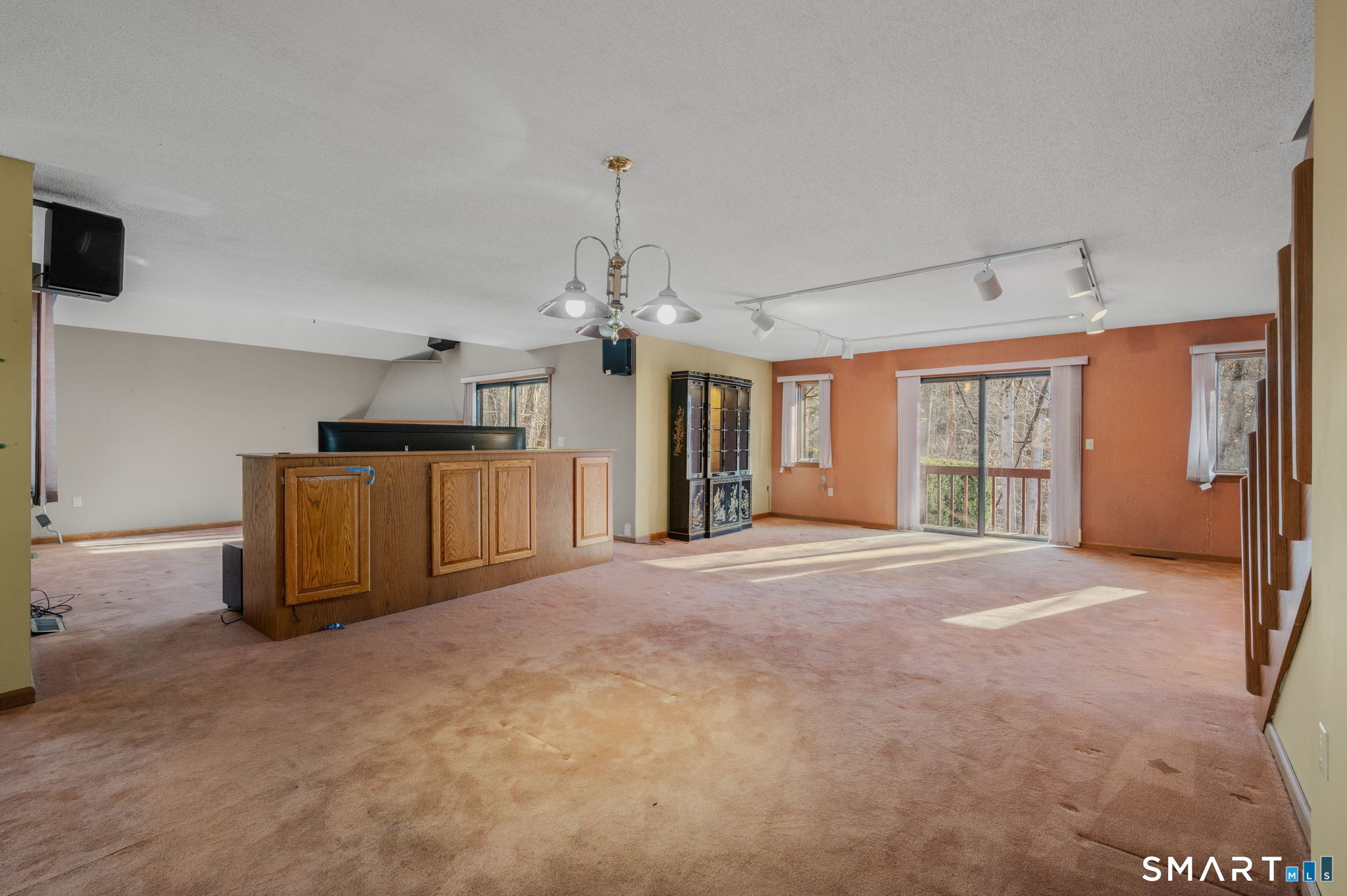 97 West Main Street, Unit 24 East Lyme, CT 06357 - Photo 9 of 39 a big room with windows and entryway