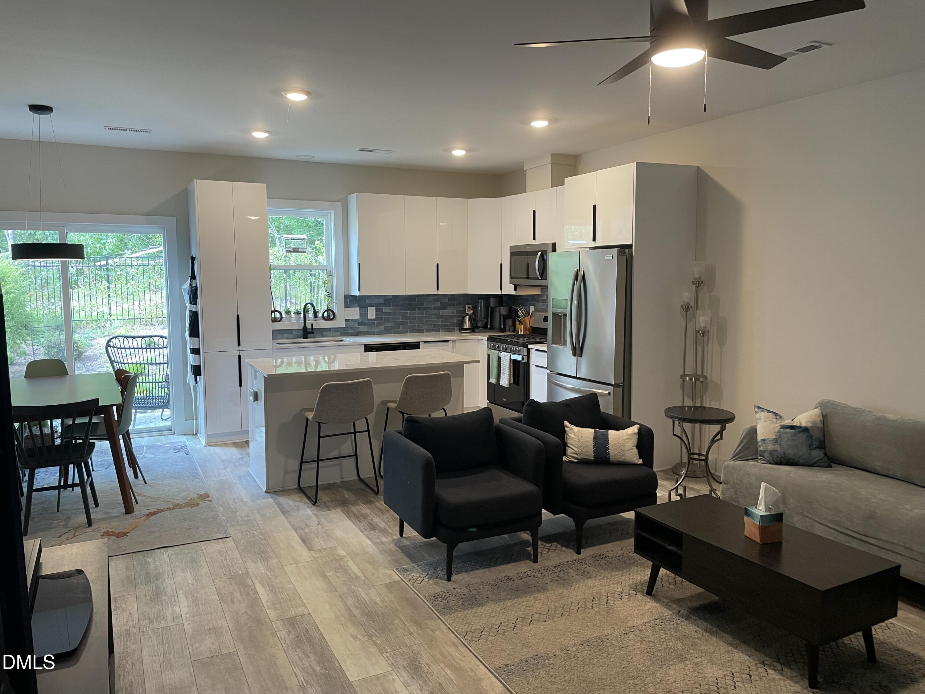 4108 Convergence Street Durham, NC 27704 - Photo 7 of 31 a living room with furniture and a large window
