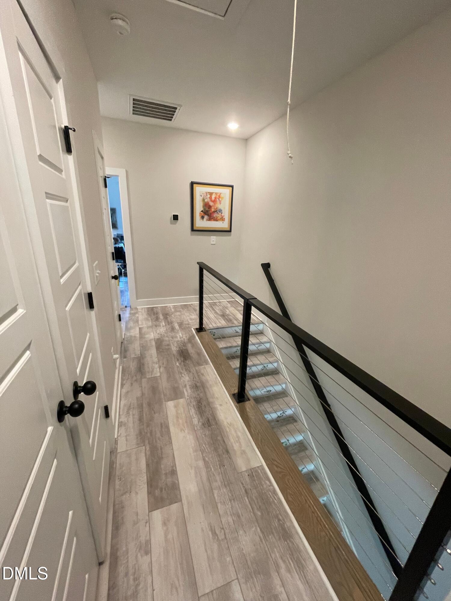 4108 Convergence Street Durham, NC 27704 - Photo 18 of 31 a view of entryway with wooden floor