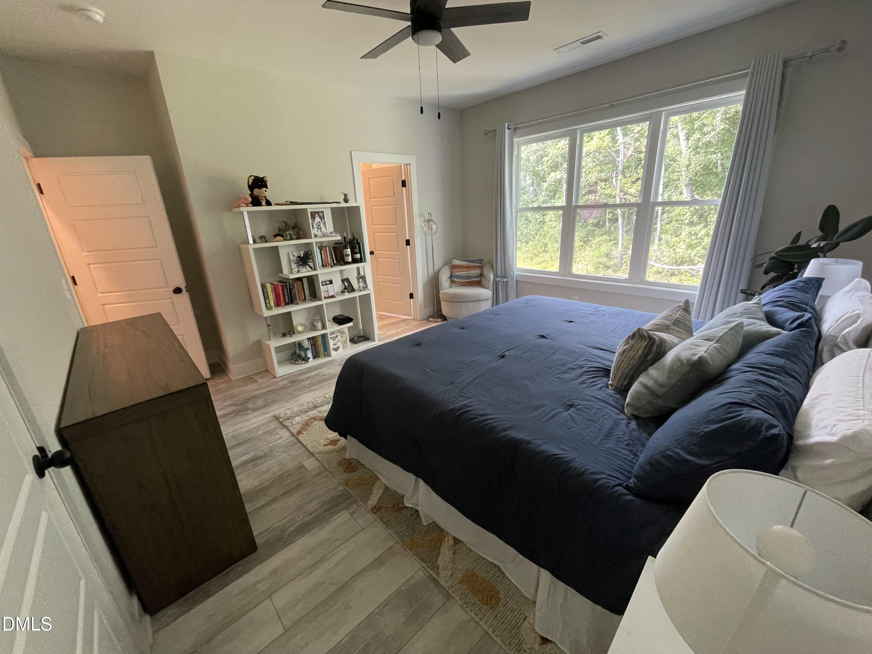 4108 Convergence Street Durham, NC 27704 - Photo 20 of 31 a bedroom with a bed furniture and a large window