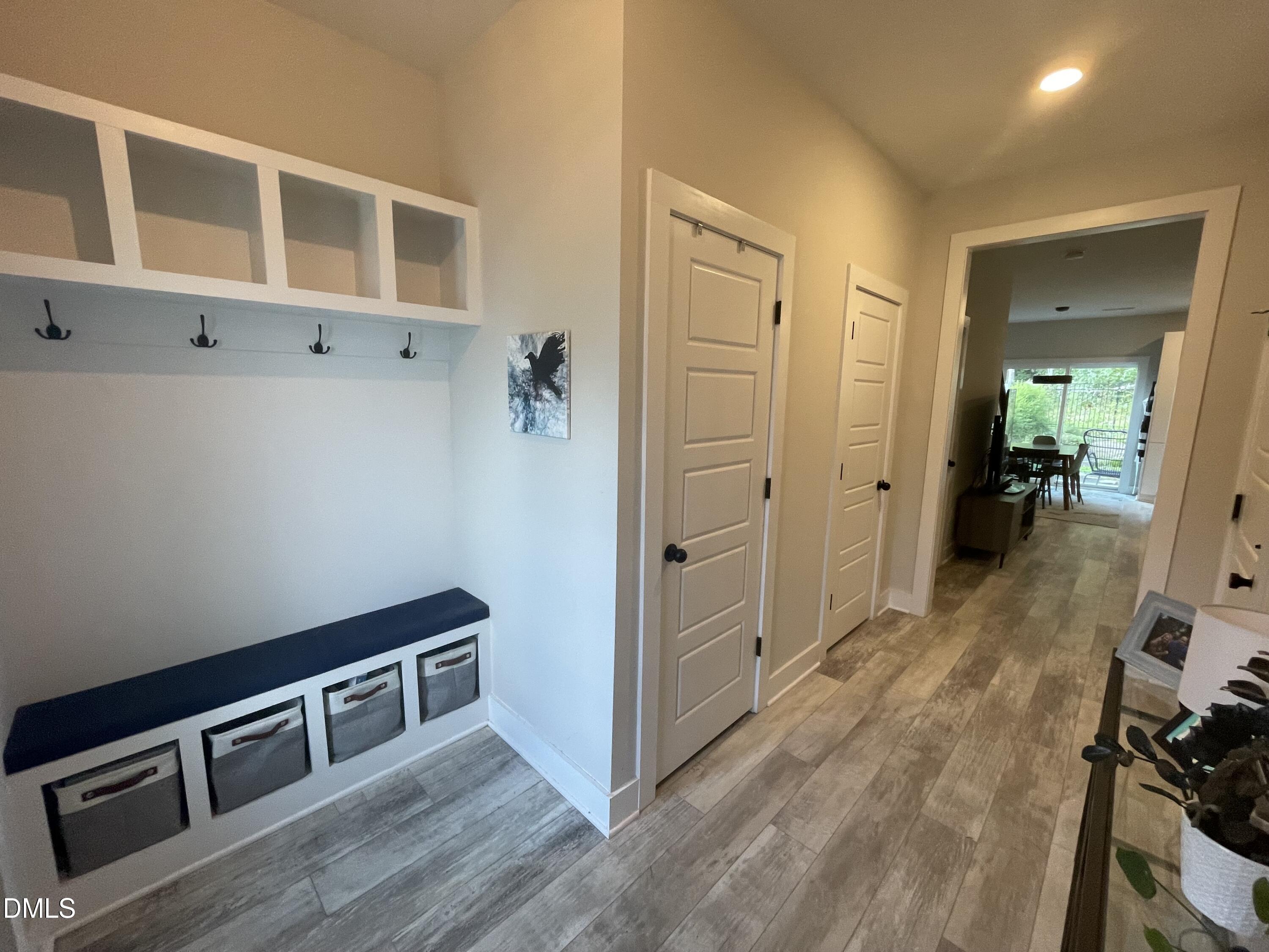 4108 Convergence Street Durham, NC 27704 - Photo 5 of 31 a view of a hallway with wooden floor and staircase