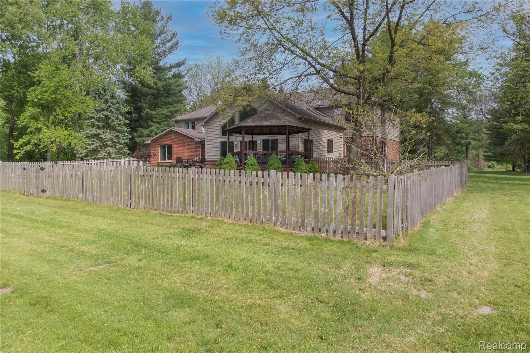 60475 9 Mile Road South Lyon, MI 48178 - Photo 38 of 44 back of house.jpg
