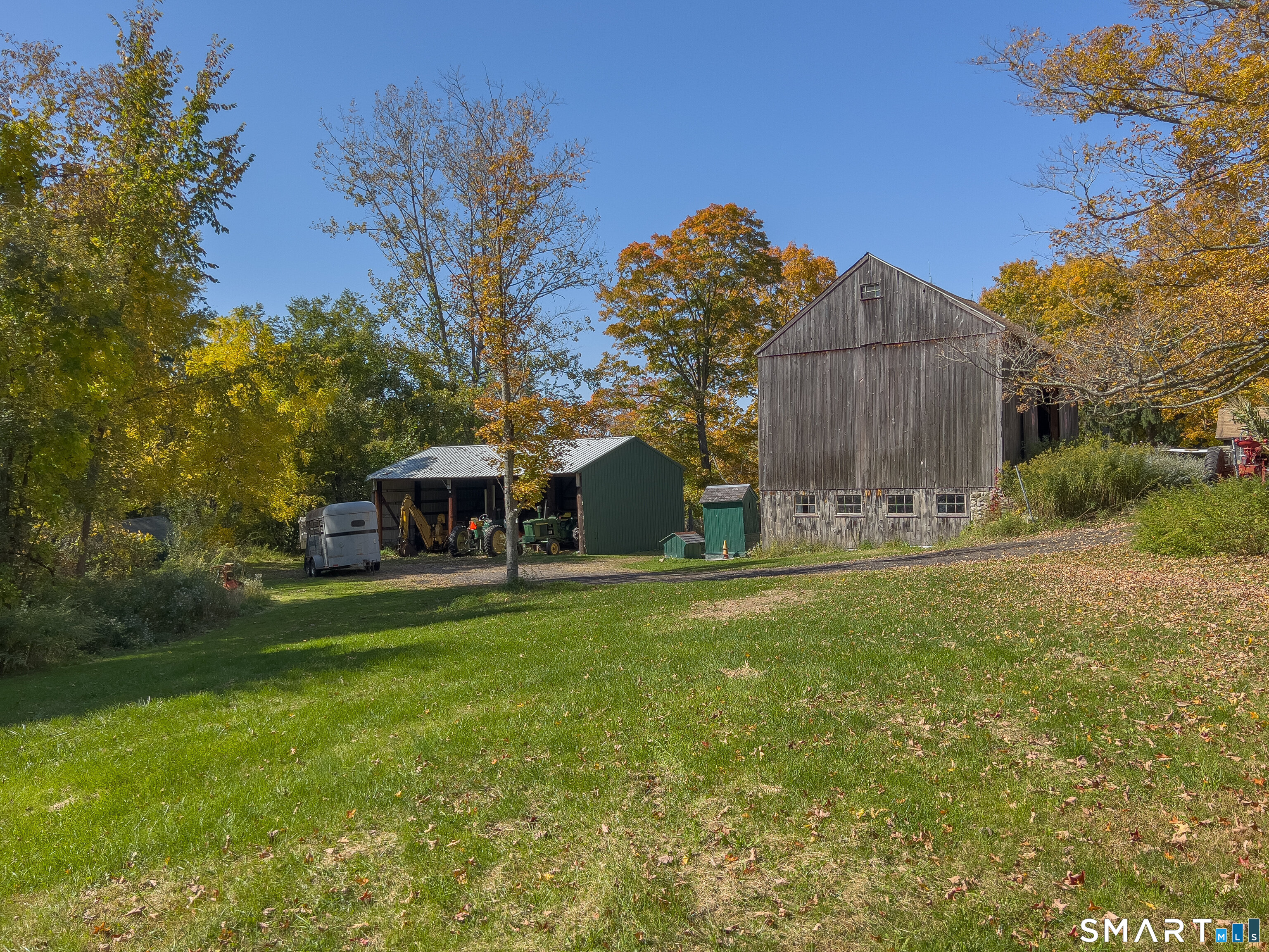 63 Currituck Road Newtown, CT 06470 - Photo 8 of 10 a front view of a house with garden