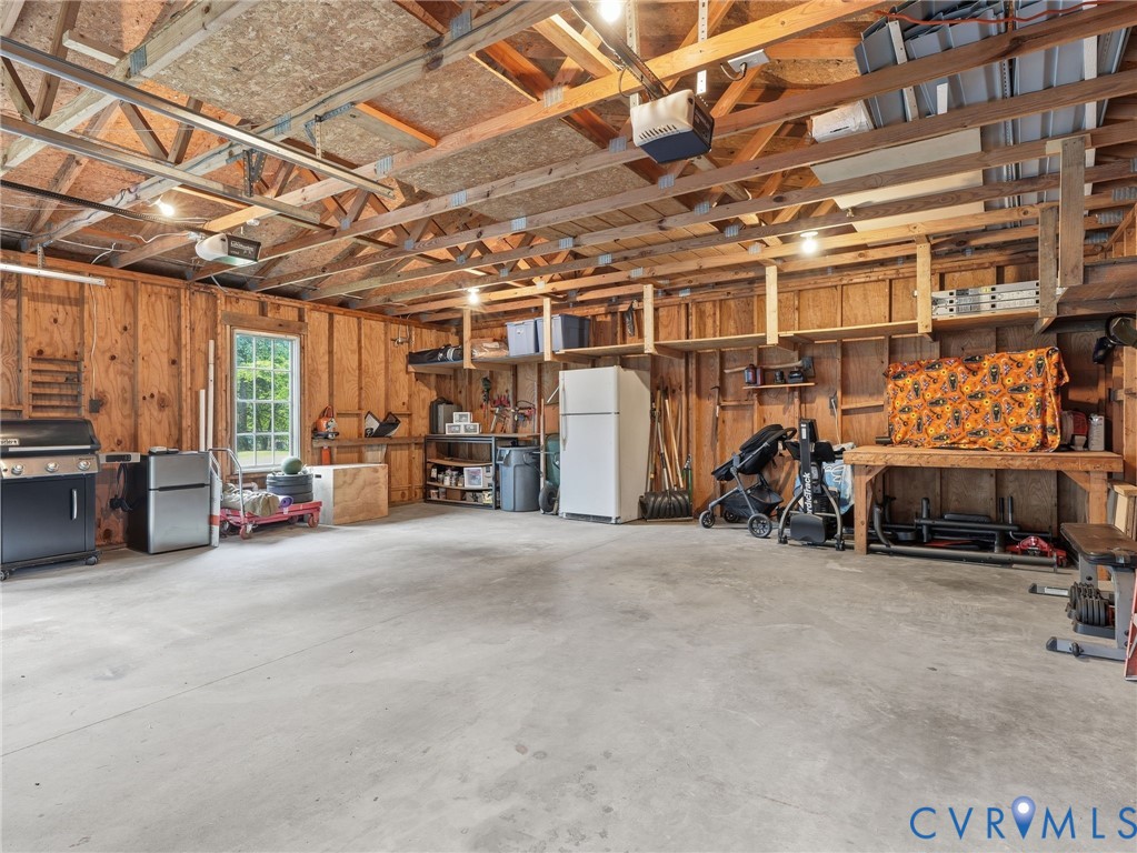 7707 Woodbrook Road Quinton, VA 23141 - Photo 36 of 42 Spacious garage interior featuring high ceilings w