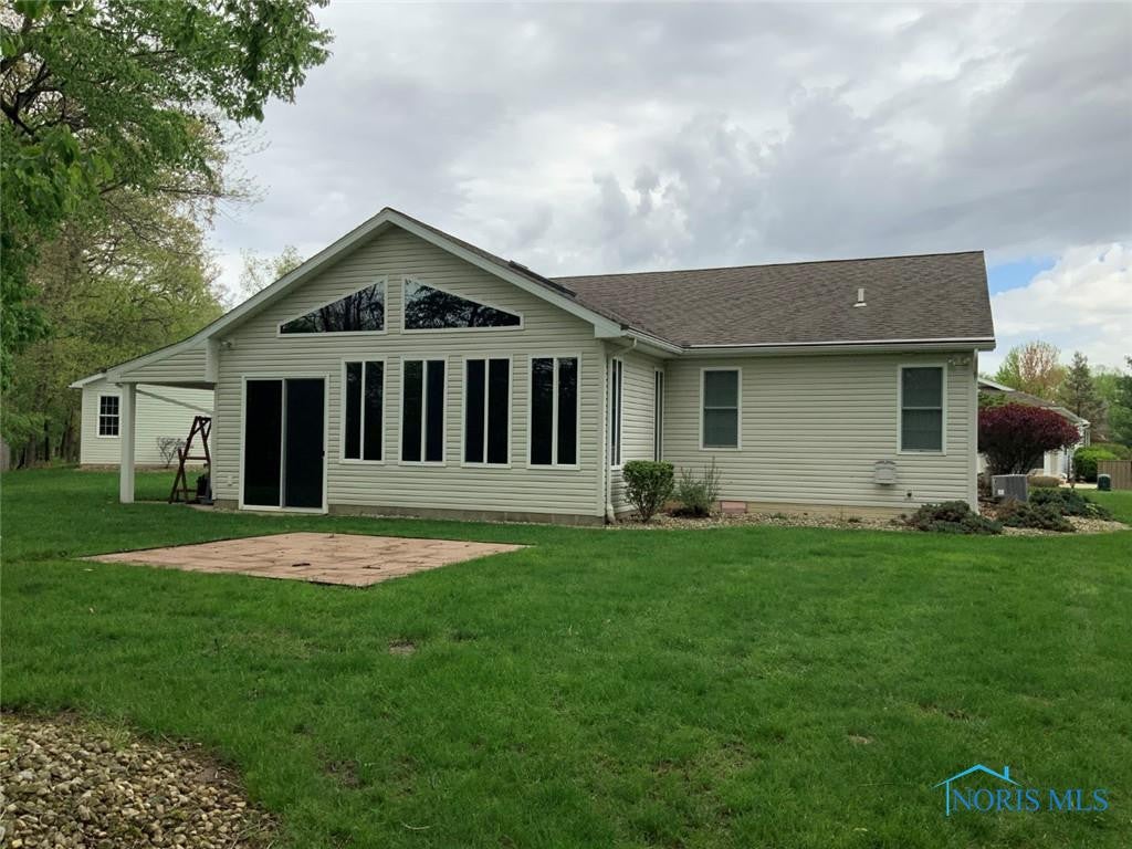 109 Rivers Edge Lane, Unit C Upper Sandusky, OH 43351 - Photo 11 of 54 Rear View of 4 Season Room