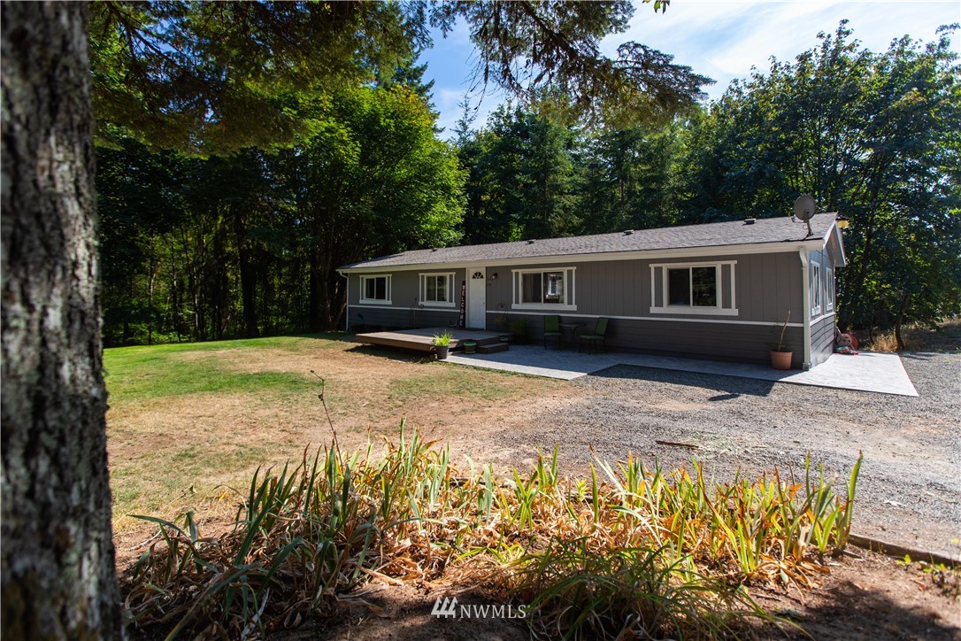 282 Woodard Road, Unit 79 Napavine, WA 98532 - Photo 1 of 29 a view of a house with pool and sitting area