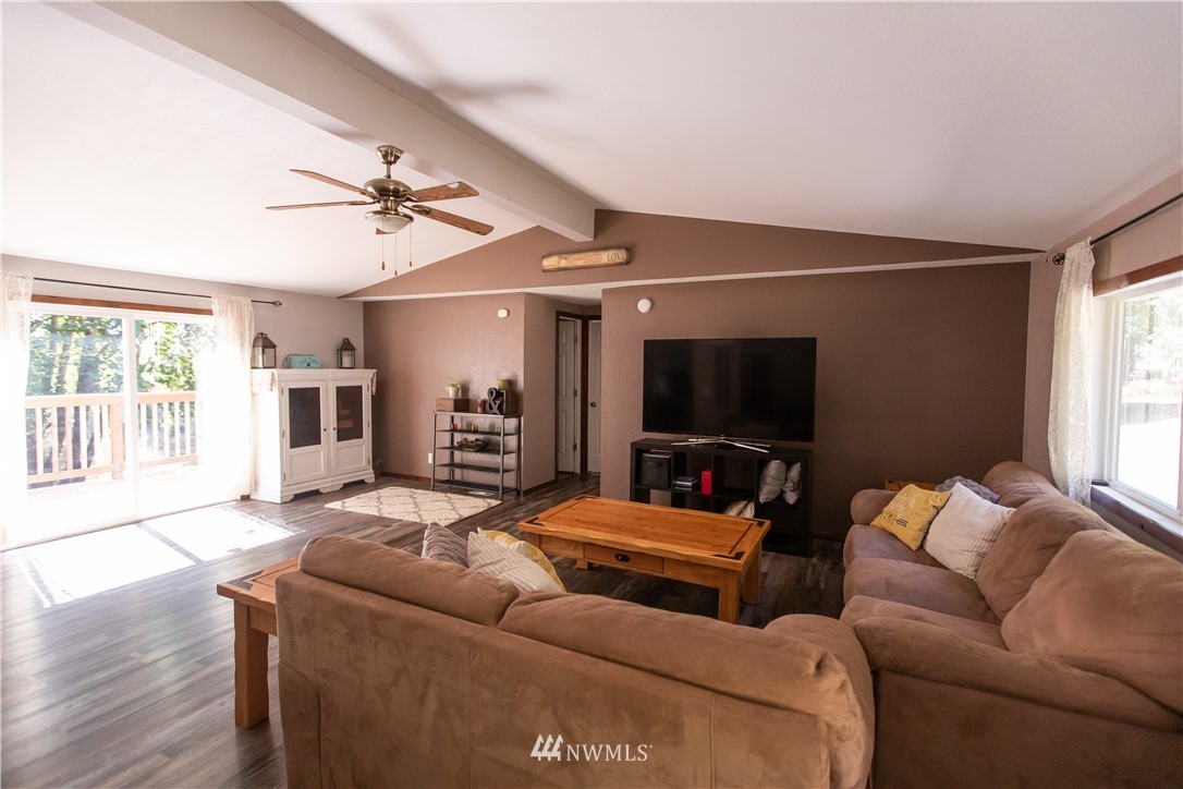 282 Woodard Road, Unit 79 Napavine, WA 98532 - Photo 13 of 29 a living room with furniture and a flat screen tv