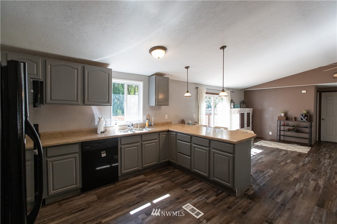 282 Woodard Road, Unit 79 Napavine, WA 98532 - Photo 15 of 29 a kitchen with stainless steel appliances granite countertop a sink stove and refrigerator