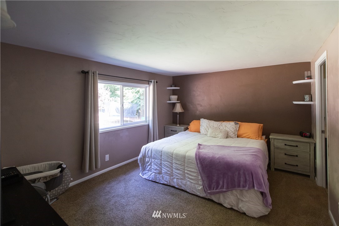 282 Woodard Road, Unit 79 Napavine, WA 98532 - Photo 23 of 29 a bedroom with a bed and a window