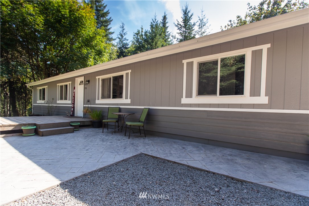 282 Woodard Road, Unit 79 Napavine, WA 98532 - Photo 4 of 29 a backyard of a house with outdoor seating