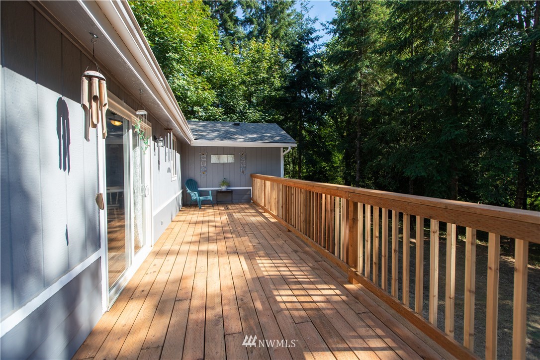 282 Woodard Road, Unit 79 Napavine, WA 98532 - Photo 5 of 29 a view of balcony with wooden floor and fence