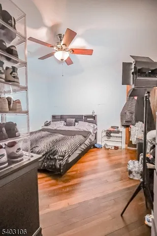 a bedroom with a bed and dresser