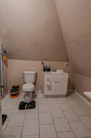 a bathroom with a toilet and a sink