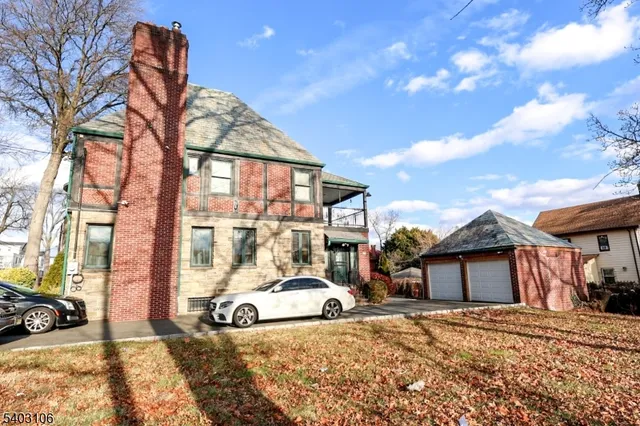 a view of a car park in front of a house