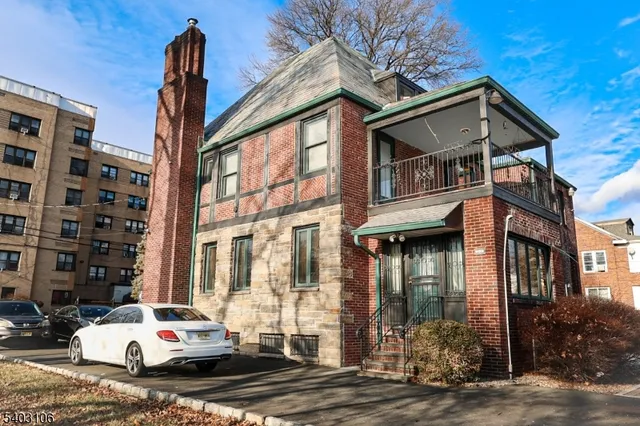 a car parked in front of a white building