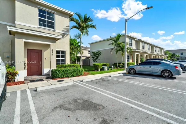 a view of a car parked in front of a building