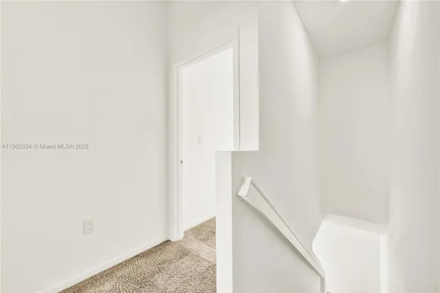 a living room with lots of furniture and a large window