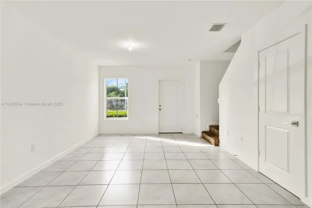a view of an empty room and window