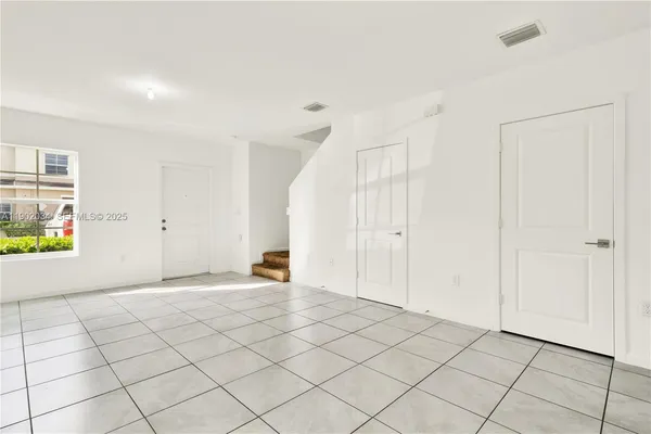 a view of an empty room and window