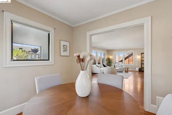 a kitchen with white cabinets and sink