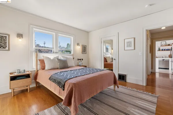 a bedroom with a bed and a couch
