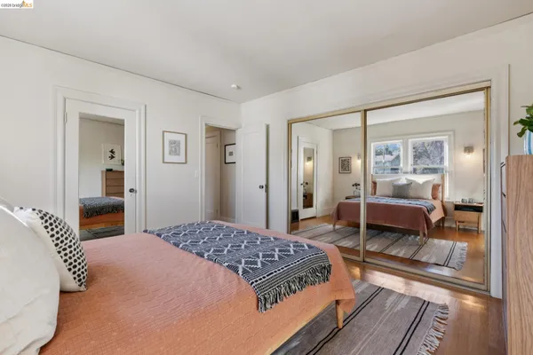a bedroom with a bed and a view of bedroom
