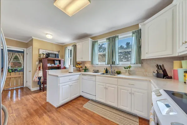 a kitchen with a sink and a window