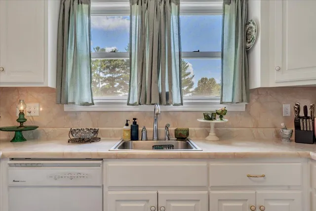 a kitchen with a refrigerator and sink