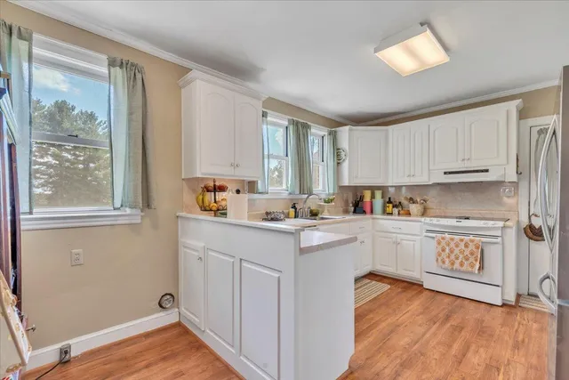 a white toilet sitting next to a bathroom sink